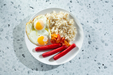 A top down view of a hot dog breakfast entree.