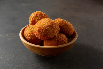 A view of a bowl of croquettes.