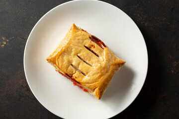 A top down view of a guava strudel on a plate.