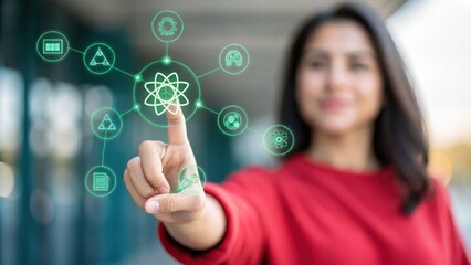 Quantum Computing Woman in red long sleeve shirt interacts with a glowing green quantum computing interface, atom symbol and network of icons