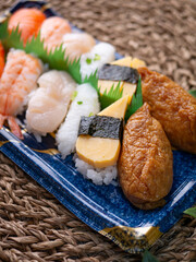 Sushi sets in plastic box trays for Delivery service.