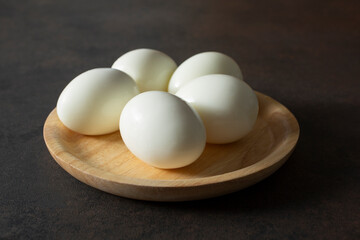 A view of a plate of hard boiled eggs.