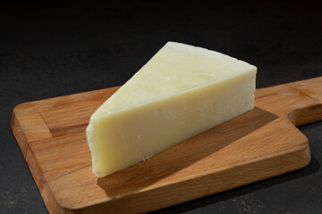 A view of a block of pecorino romano cheese.