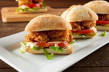 A view of a plate of mini po boy sandwich.