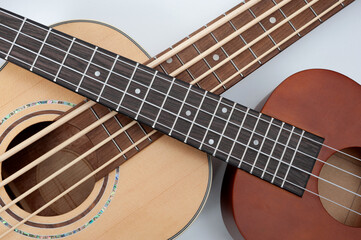 Fototapeta premium Four-string bass ukulele with wooden body and built-in tuner and pickup.