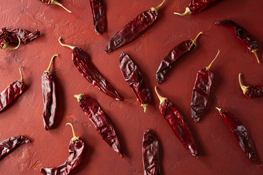 A top down view of a scattered pile of guajillo chile, as a background.