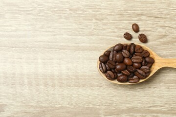 Coffee beans on wooden background