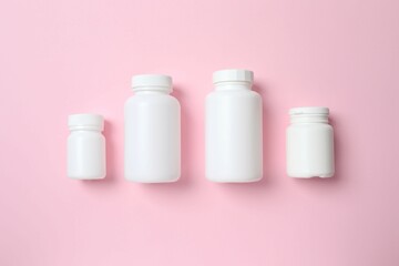 White bottles on color  background, top view