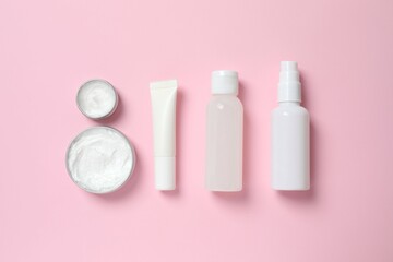 Natural cosmetic products a pink background, top view