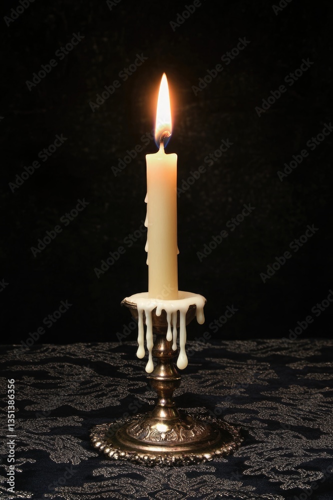 Poster a single lit candle placed on a table, ready for use
