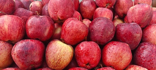 A pile of fresh red apples open sell in Indian market.