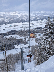 POV Ski lift up a steep slope