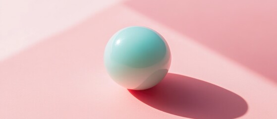 A blue egg sitting on a pink surface