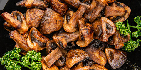 Mushrooms fried champignons vegetables dish fresh delicious gourmet food background on the table rustic food top view copy space keto and paleo diet vegetarian and vegan food