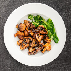 Mushrooms fried champignons vegetables dish fresh delicious gourmet food background on the table rustic food top view copy space keto and paleo diet vegetarian and vegan food