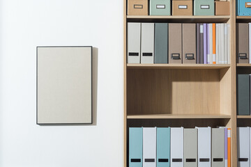 Tidy office interior with bookcase