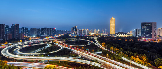 Fototapeta premium Night view of CBD and overpass in Zhengdong New District, Zhengzhou, Henan, China