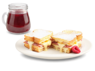 Monte Cristo Sandwich A Monte Cristo sandwich with ham and Swiss cheese, dipped in egg batter and fried