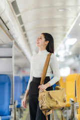 Journey of Hope: An elegant young woman gazes upward with a hopeful expression while standing on a train, a symbol of travel, aspirations and the journey of life.