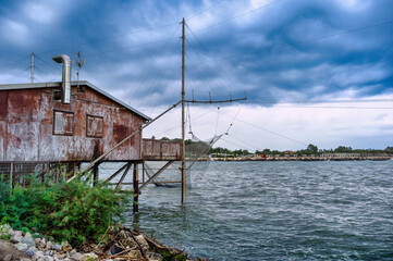 Fototapeta premium Fishermen's hut with nets cast into the sea