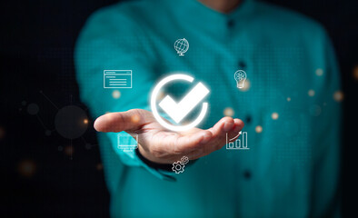 Businessman show checked icon on virtual screen, service guarantee, quality assurance management.