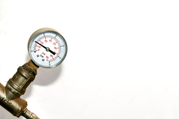 Hot water temperature sensor in a basement plumbing system on white