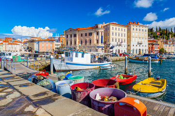 Cityscape of Piran with fishing boats and nets in the foreground, Slovenia © Travellaggio