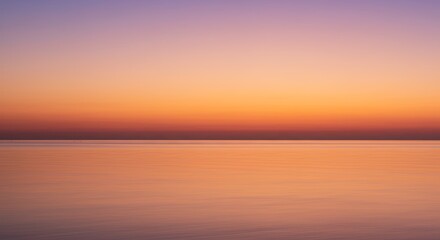 Obraz premium Serene Sunset Over Calm Ocean Peaceful Twilight Seascape
