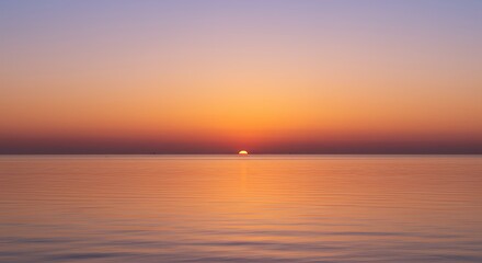 Serene Sunset over Calm Ocean Water