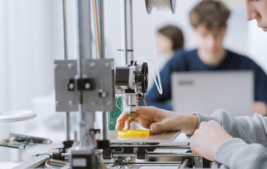 Student printing 3D prototypes in the lab