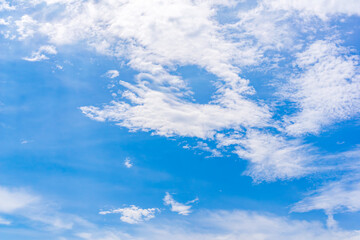 Radiant sky meets fluffy clouds. A tranquil panorama of nature's beauty, perfect for evoking peace...