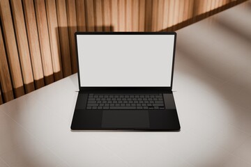 High end laptop on tile studio floor and acoustic backdrop. Blank mockup template screen. Spotlight from above