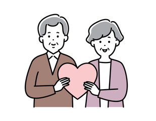 一緒にハートを持つシニア夫婦