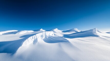A deep blue Arctic sky contrasting with pure white snow. 