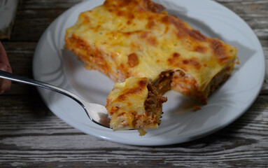 Savory dish served on a rustic table with rich layers of flavor at a cozy gathering during the evening