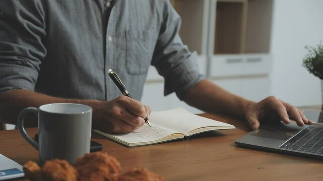 Candid young attractive asian female employee wear earphone listen to digital online course development program in quarantine social distance at home reskill upskill school class for career path.