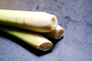 Closeup of three lemongrass stalks. Isolated lemongrass stem which functions as an aromatic with...