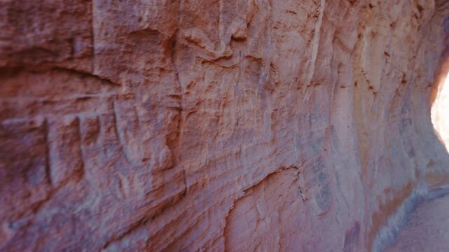 A stone wall with petroglyphs, inscription in Al-Siq, the narrow passageway known as the al-Siq, runs from al-Diwan (a square chamber that served as a triclinium for sacred feasts), Hegra, Saudi Arabi