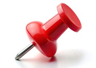 A single red pushpin, a tiny office hero, stands out against a clean white backdrop in this macro shot.