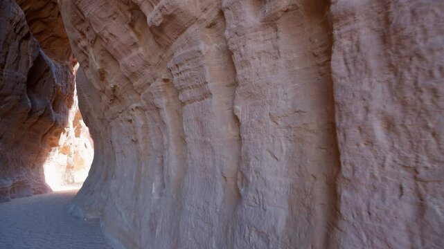 A stone wall with petroglyphs, inscription in Al-Siq, the narrow passageway known as the al-Siq, runs from al-Diwan (a square chamber that served as a triclinium for sacred feasts), Hegra, Saudi Arabi