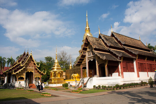 Thai people and foreign traveler travel visit respect praying buddha god angel deity and relics golden chedi stupa at  Wat Phra Singh Woramahaviharn Temple on November 10, 2020 in Chiang Mai, Thailand