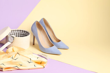 Beautiful scarf, box with watch and heels on color background. Space for text