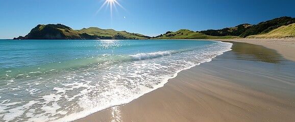 Obraz premium Serene Beach Landscape with Green Hills and Turquoise Water