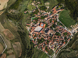 Fototapeta premium ancient roman town Medinaceli with old cozy streets and historic buildings aerial top view, old medieval european village drone view, Spain
