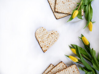 Layout of Traditional Matzah shape of heart prepared for Passover with on white background. banner. top view. Spring Holiday of Jewish people. Fasting time