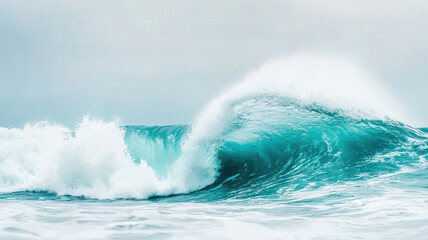 Obraz premium beautiful wave crashes gracefully against ocean surface, showcasing vibrant turquoise hues and frothy white foam. serene atmosphere evokes sense of calm and tranquility