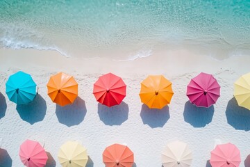 Colorful beach umbrellas lined up on white sand by turquoise sea, perfect for summer travel promotions, tropical vacation ads, or beach lifestyle visuals