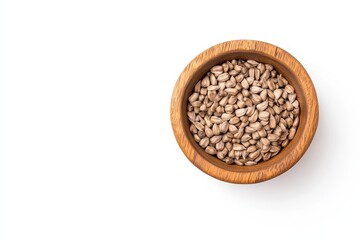 A wooden bowl filled with small, light-colored seeds, placed against a clean white background.