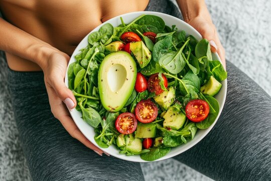 Embracing healthy living with a vibrant salad bowl in hand Generative AI