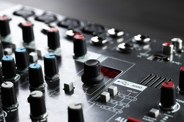 Professional mixing console on table, closeup. Radio studio equipment